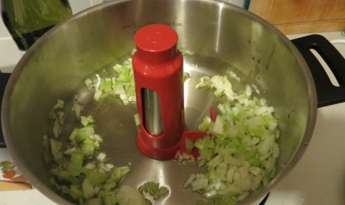 To our glug of olive oil, we add onion and celery, Soften at 130C for 10 mins.