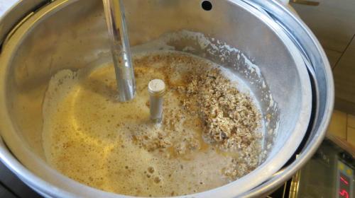 The grain needs to be stirred in as it's added to prevent clumping.  You end up with a lovely porridge.