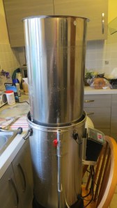 The grain basket lifts up and sits on the outer vessel for draining and sparging.