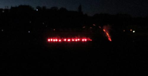 Then, finally, the music started, and the river was lit with floating red flares.